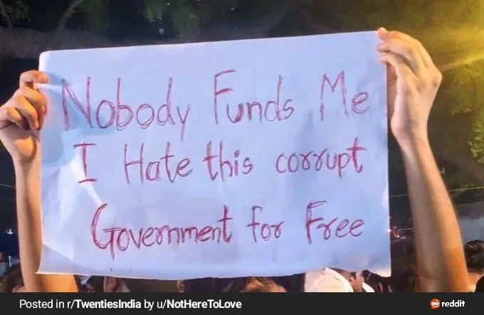 “Nobody funds me” night placard