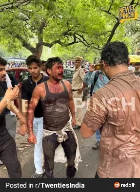 Wider view of visibly injured man